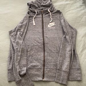 Grey Nike zip up hoodie.